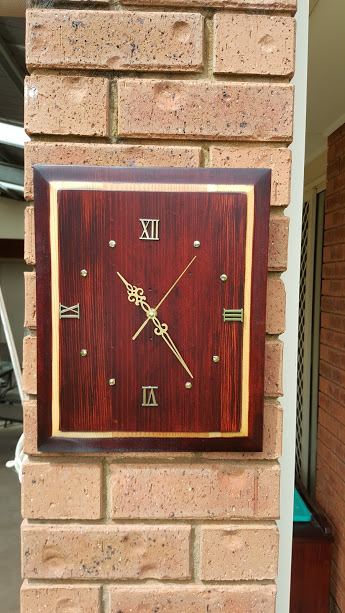 Wooden clock made from the front of a broken drawer