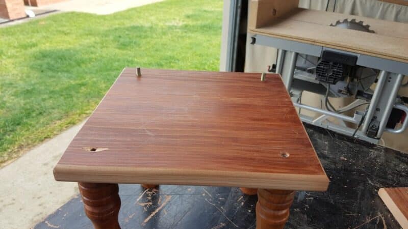 Backrest supports attached to the legs using hanger bolts and insert nuts.