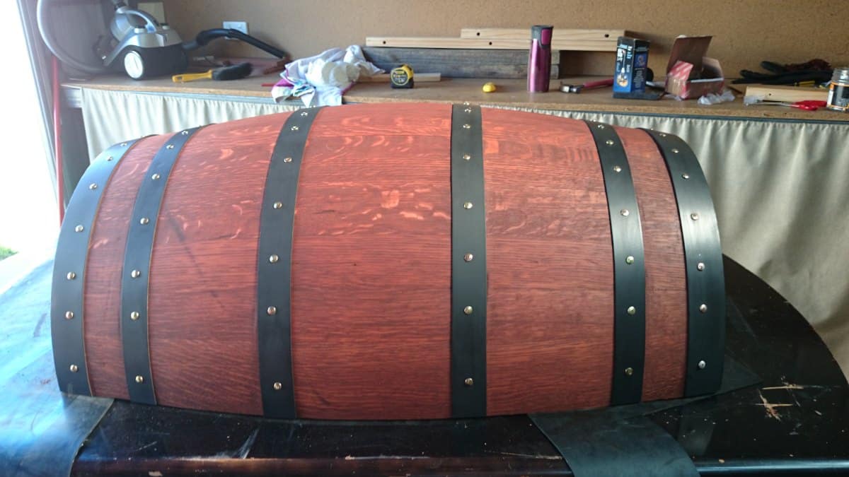 stained half wine barrel with painted bands