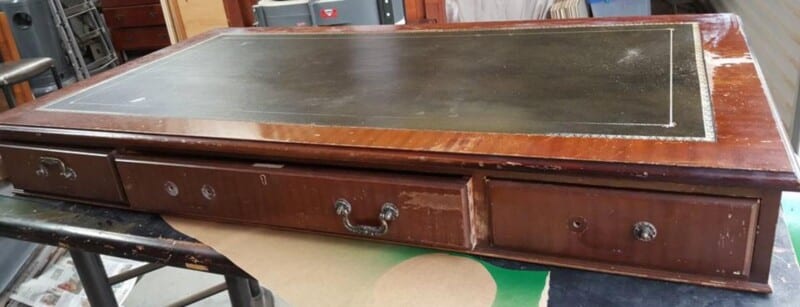 Condition of the Leather top desk before restoration.