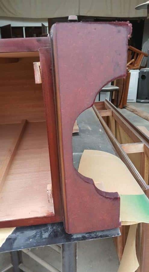 Close-up of repaired MDF base stained in dark mahogany.