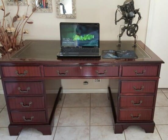 Restored office desk with leather top.