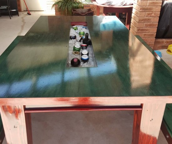 Rustic beer trough table outdoors with ice trough