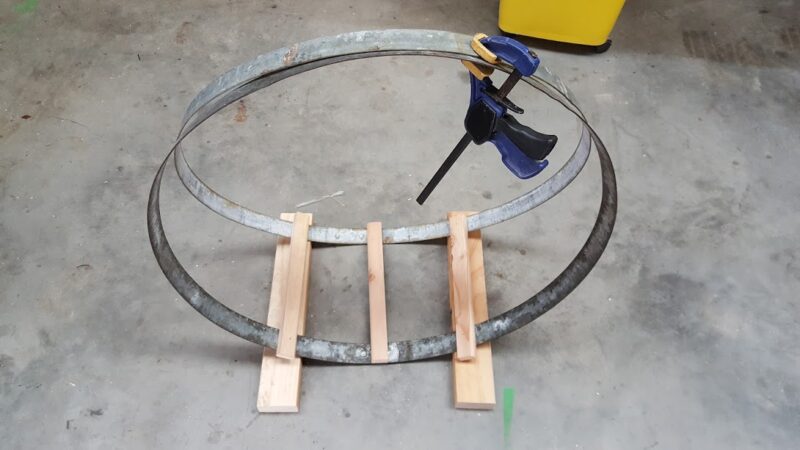 two wine barrel bands clamped together with 