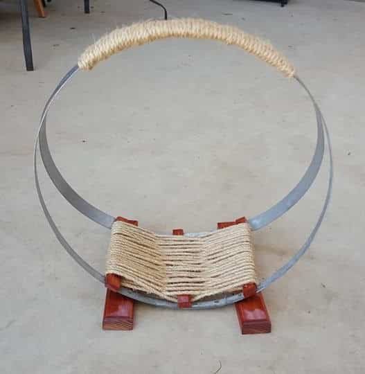 Complete Firewood stand made with wine barrel bands and sisal rope.