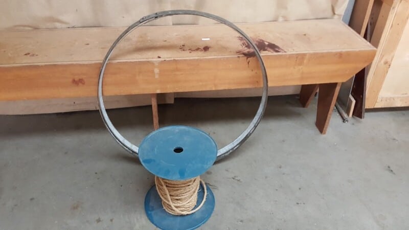 Wine barrel bands and sisal rope for firewood stand.