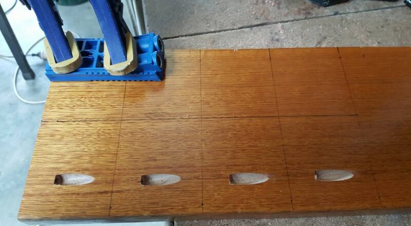 Drill creating angled holes in wood using a pocket hole jig

