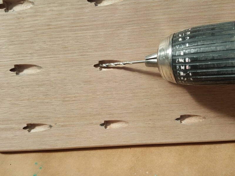 Standard drill bit used to widen and deepen holes for better dart fit

