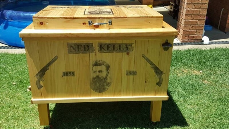 wooden chest cooler for storing ice and drinks with Ned Kelly Images on all sides