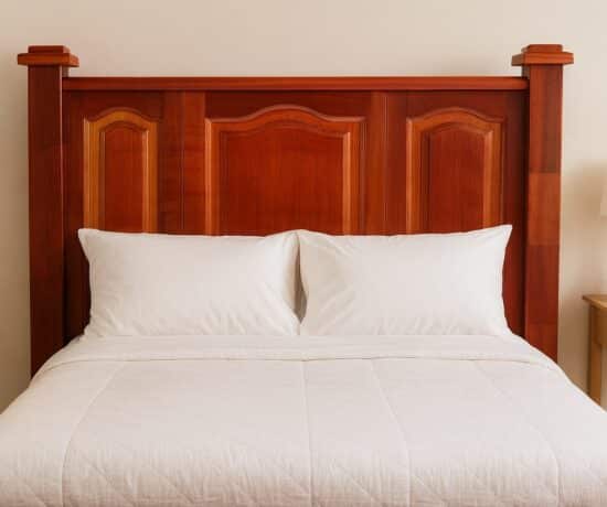 Finished headboard styled for an adult guest room