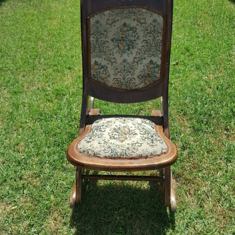 Before photo of the antique rocking chair with worn-out fabric