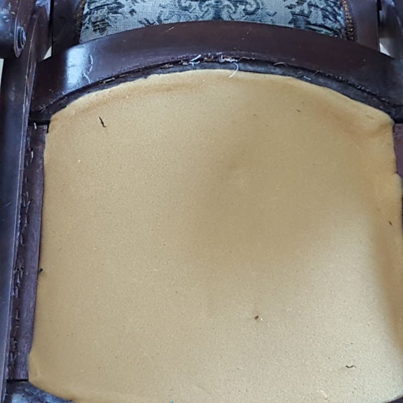 Rocking chair with staples lifted for removal
