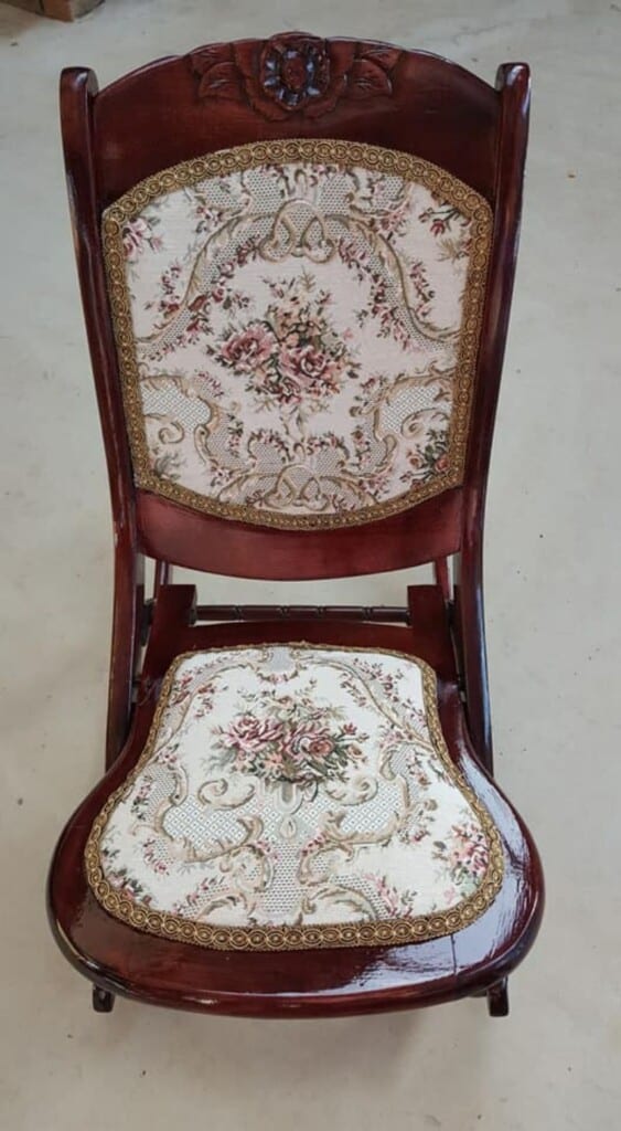 Finished restored rocking chair with rich stain and new fabric