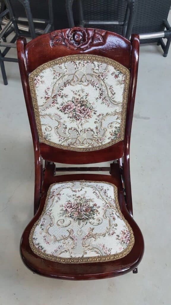 Finished restored rocking chair with rich stain and new fabric