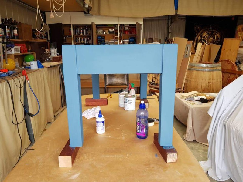 Painted table showcasing chalk paint and red gel stain glaze