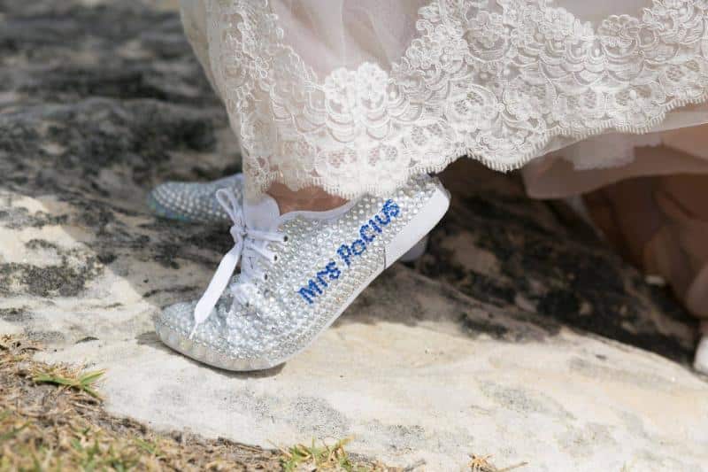 Customised bridal sneakers with "Mrs Pocius" in blue rhinestones