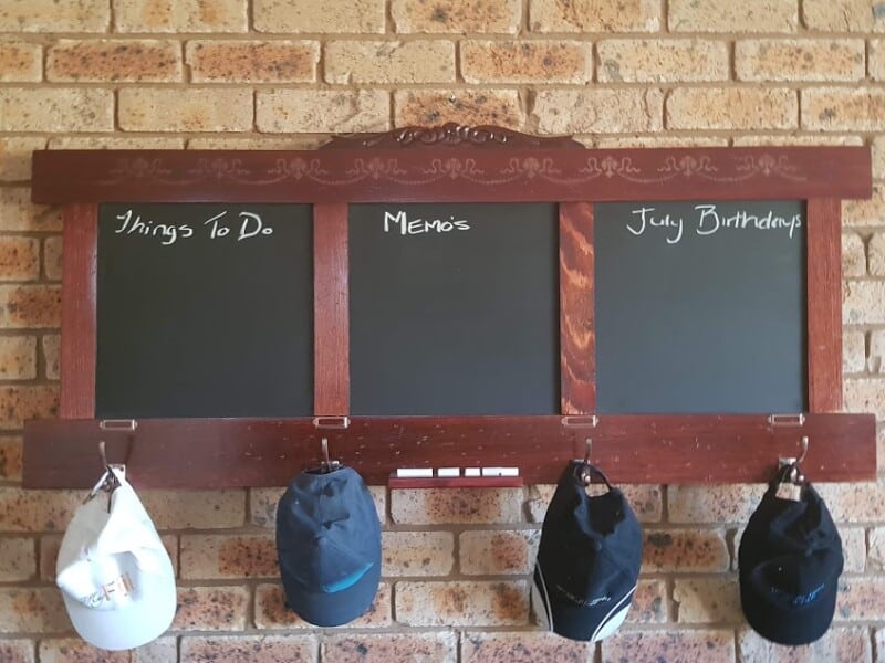 Headboard Repurposed into a Chalkboard Hat/Coat Rack- with hats