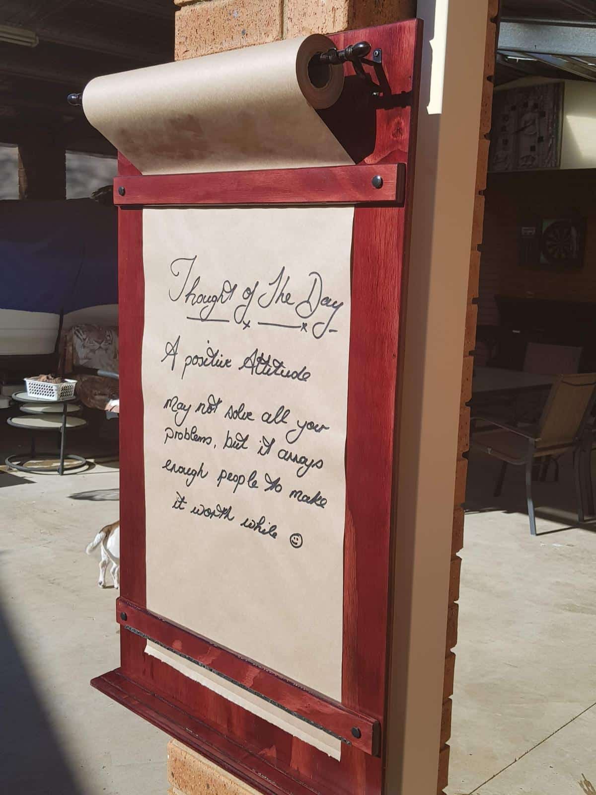 DIY wall-mounted kraft paper message board finished and hung on wall- side view