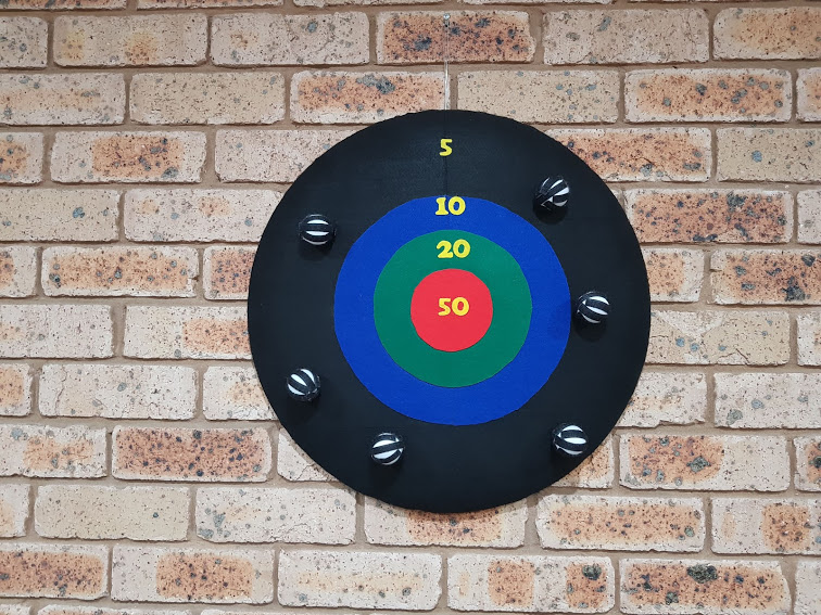 Target shooting game with Velcro balls.