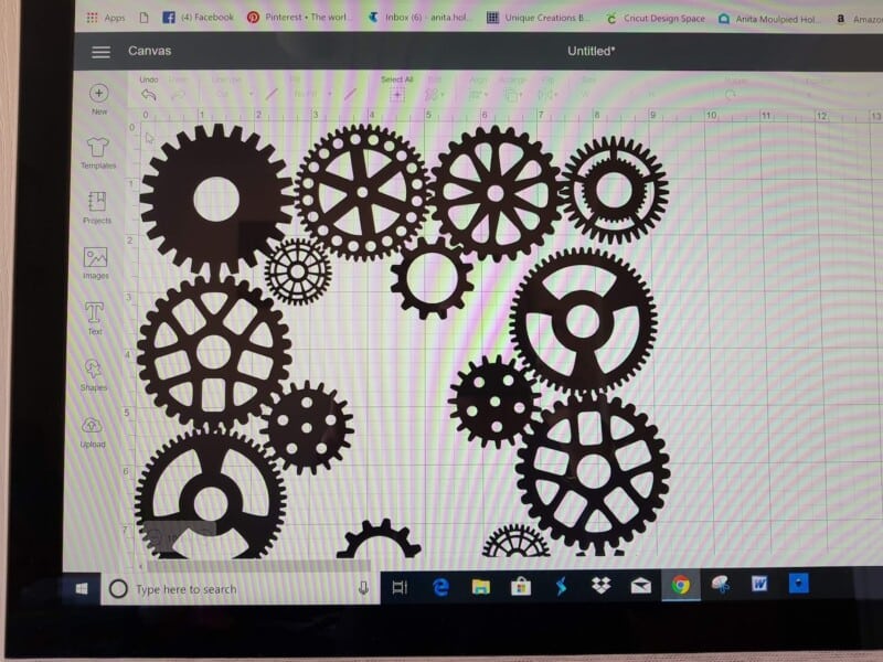 Cricut Explore Air 2 cutting steampunk dragon design from heat transfer vinyl for suitcase cover