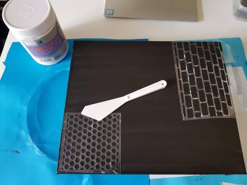 Showing how the stencils are used with texture paste.