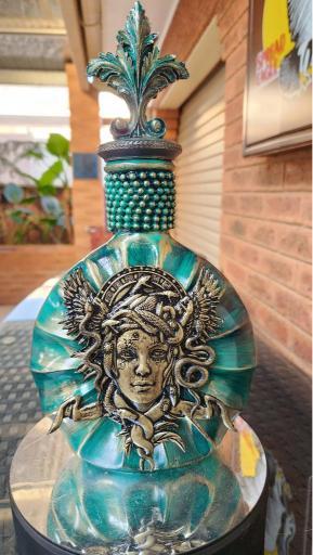 Example of other mixed media art bottles made from recycled alcohol bottles.