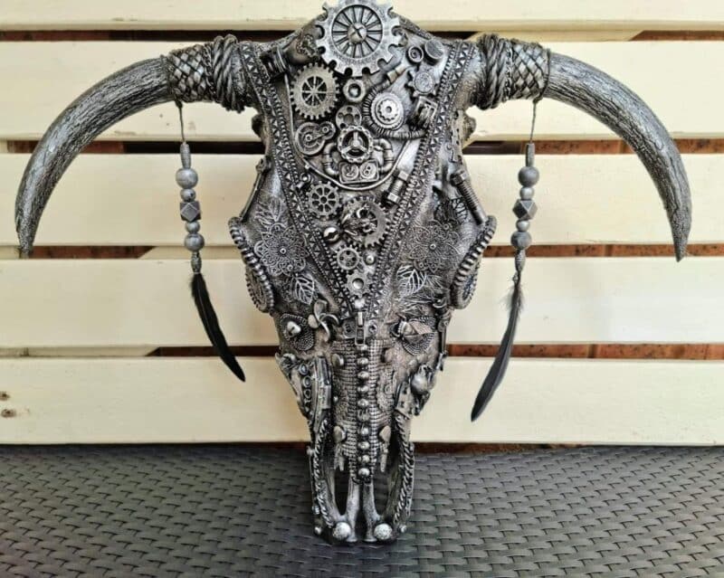 Steampunk themed mixed media art cow skull