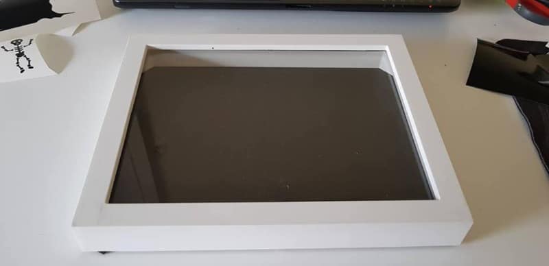 Shadow box frame used for bridesmaid invitations.

