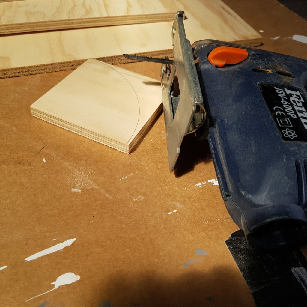 Cutting curved shelf fronts with a jigsaw before final sanding