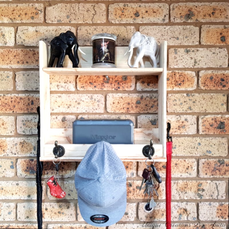 Wall mounted shelf made from pallet wood to store hats, keys, dog leads and ornaments.