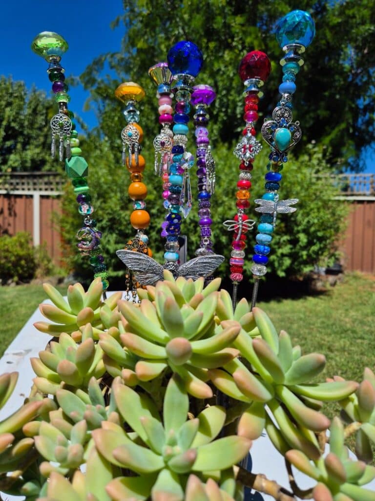 Beaded garden stakes with beads and glass doorknobs. 