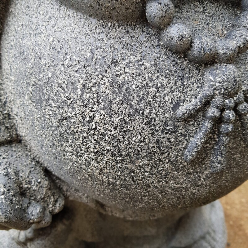 Close up view of stone effect spray on statue