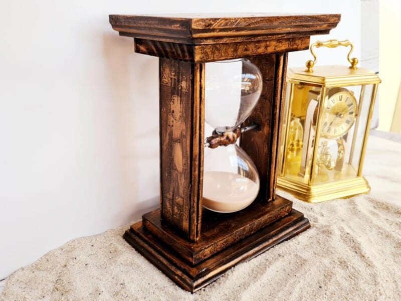 Egyptian‑Themed Sand Timer Stand displayed in sand