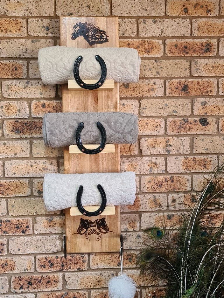 Towel rack made from recycled horse shoes