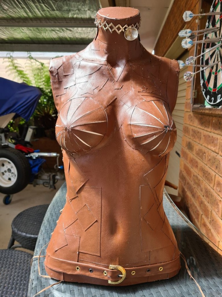 Mannequin completely covered in leather patches