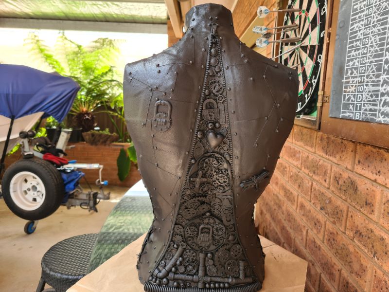 steampunk mannequin painted black- back view