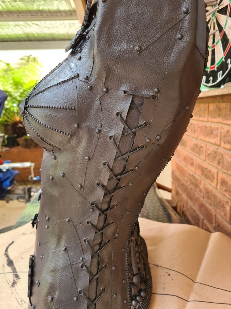 steampunk mannequin painted black- side view