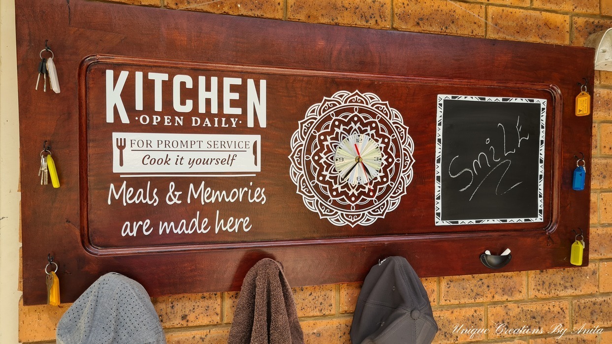 Kitchen sign made from recycled piano panel.