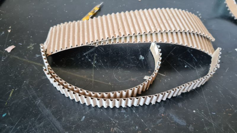 Peeling paper layer to reveal corrugated texture- clean texture using water