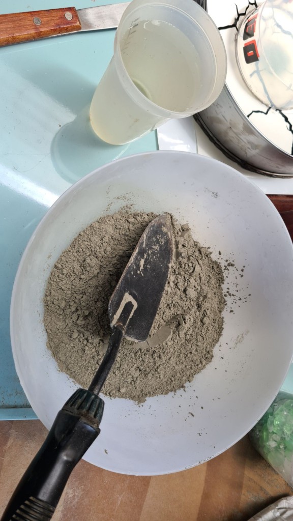 cement mixed in plastic dowl