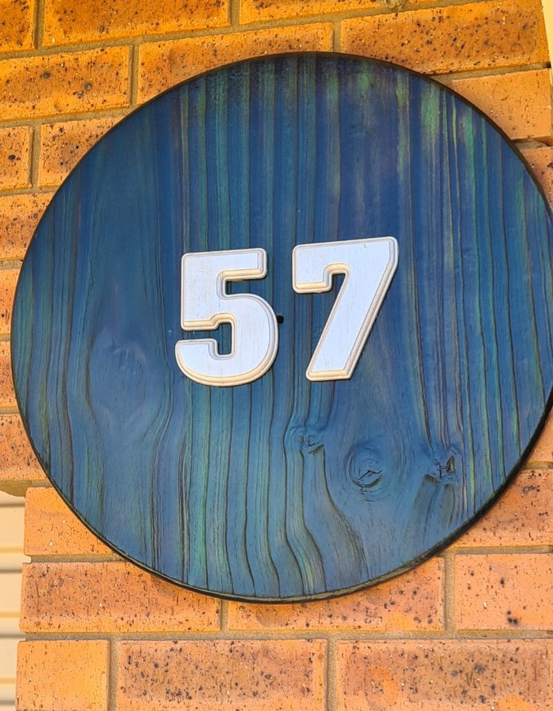DIY house number made using Shou sugi ban wood burning technique and stained using unicorn spit stain and glaze.