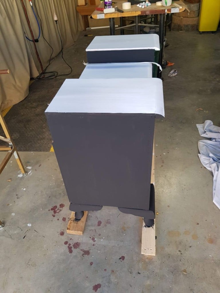 Black acrylic paint applied evenly to dresser base