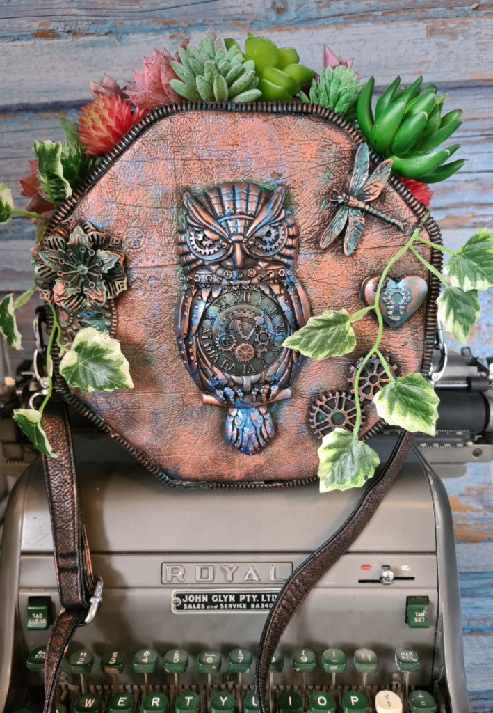 Faux Succulent Planter made from a recycled quality street tin.