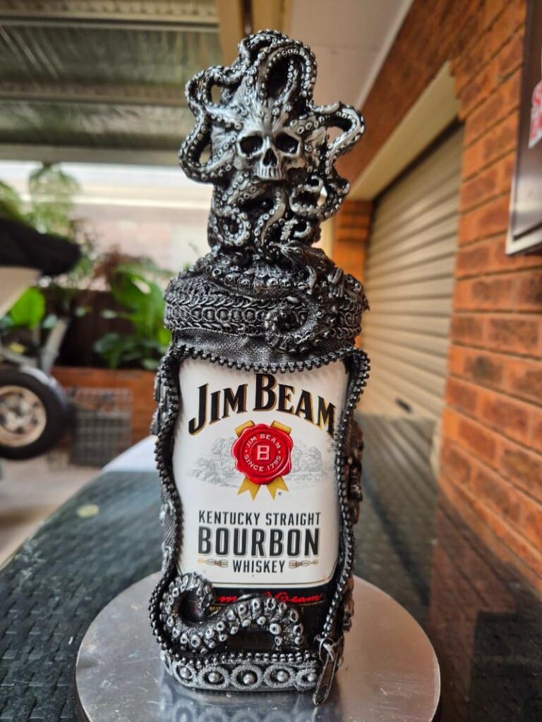 Salvaged zippers arranged for use in assemblage