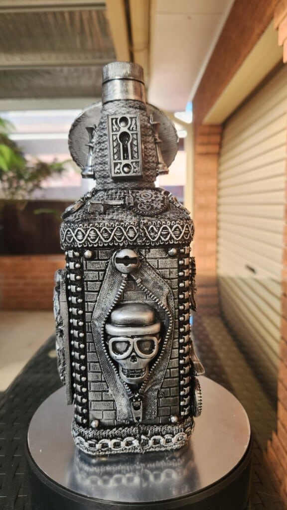 Salvaged zippers used to highlight and object arranged for use in assemblage