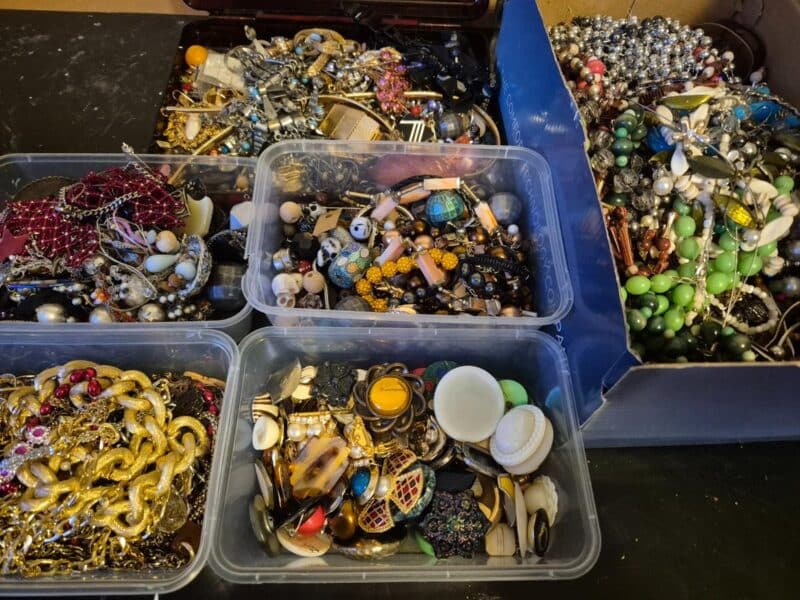 large assortment of brooches