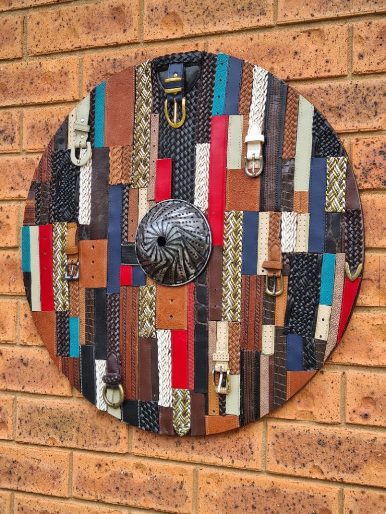 wall hanging made from recycled leather belts