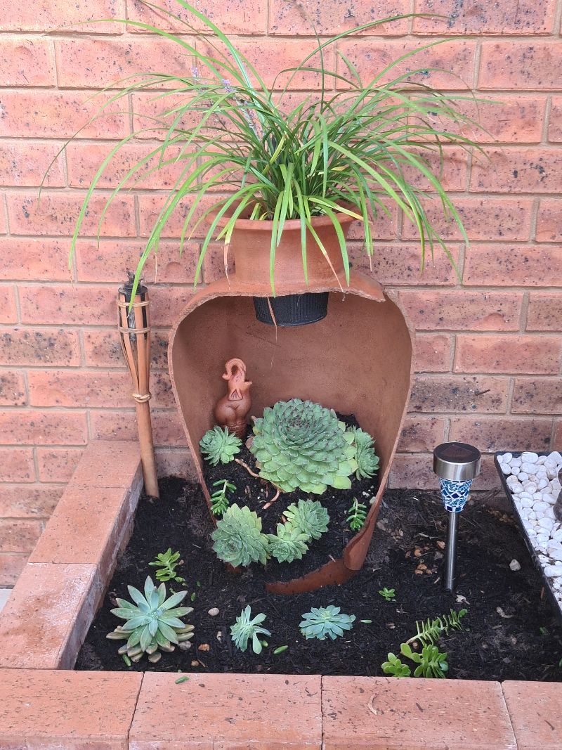 Repurposed broken terracotta pot