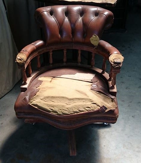 Captain’s chair before restoration with worn varnish and scratches