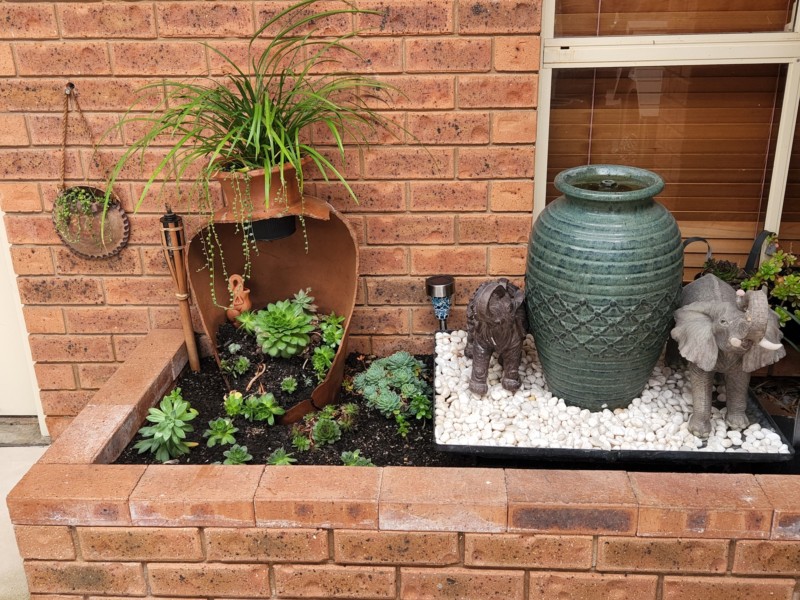 Broken Terracotta vase repurposed into garden feature